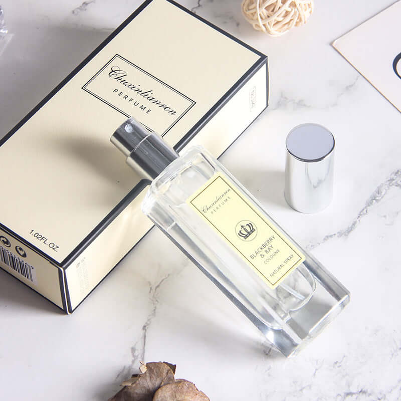 Long-lasting light perfume for women with elegant packaging in a stylish bottle on a marble surface.