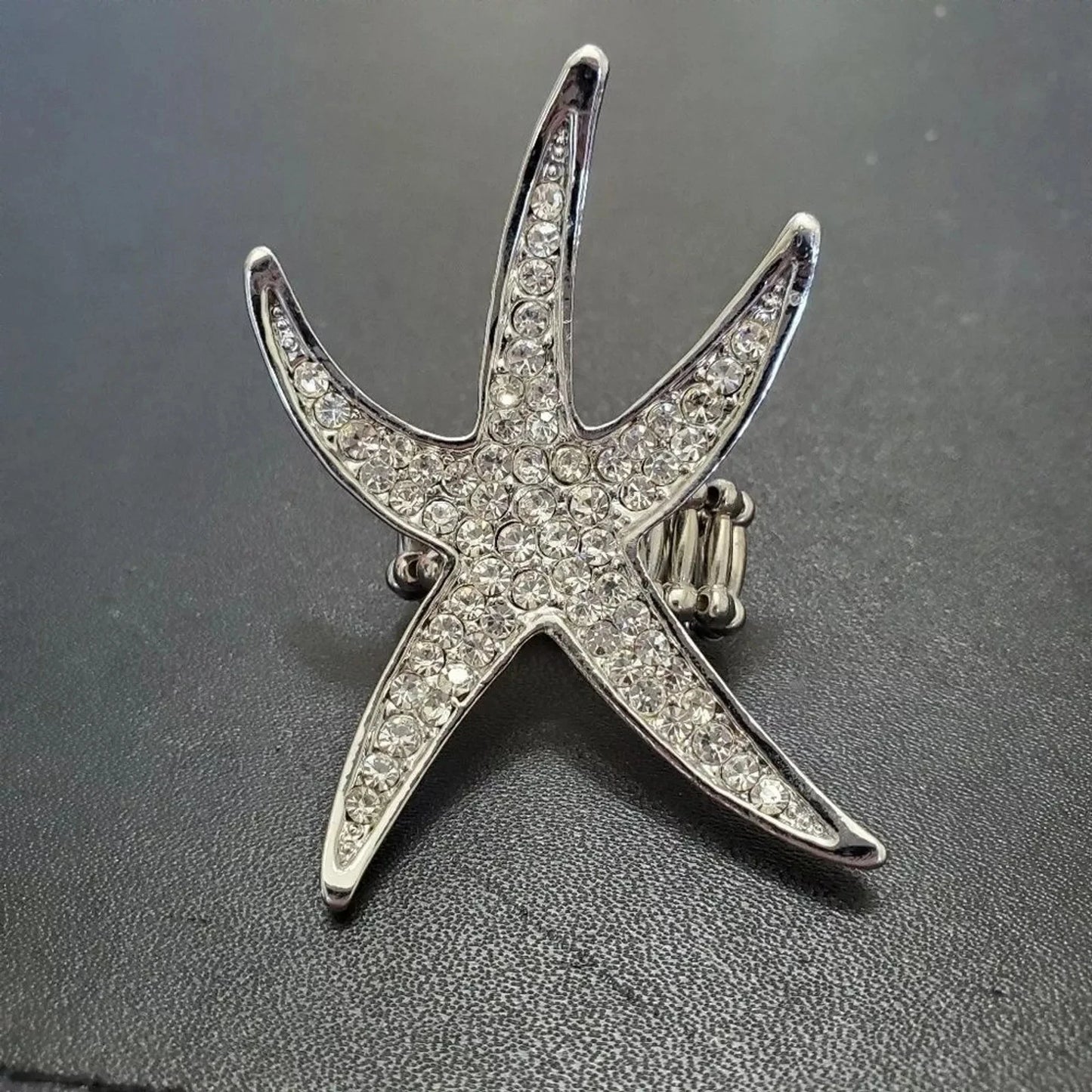 Silver tone rhinestone star ring